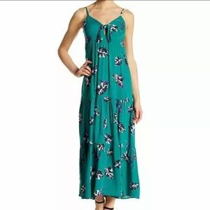 Green maxi dress with black palm leaf print.